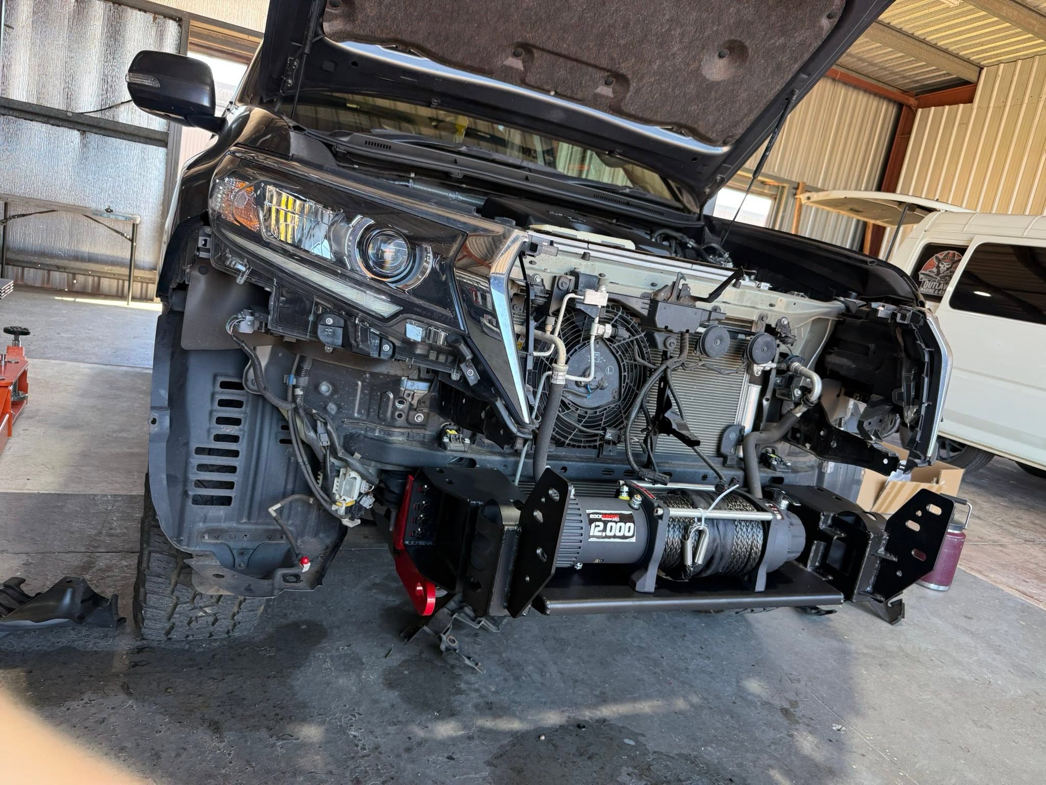 Diesel mechanic working on a 4WD at Outlaw Marine and 4x4 Darwin
